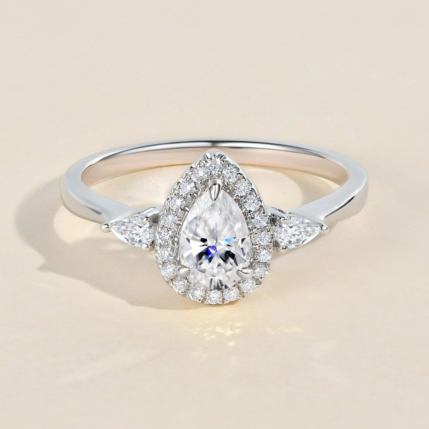 1.0ct Pear Shaped Moissanite Three-Stone Halo Ring Workwear Style Everyday Pick