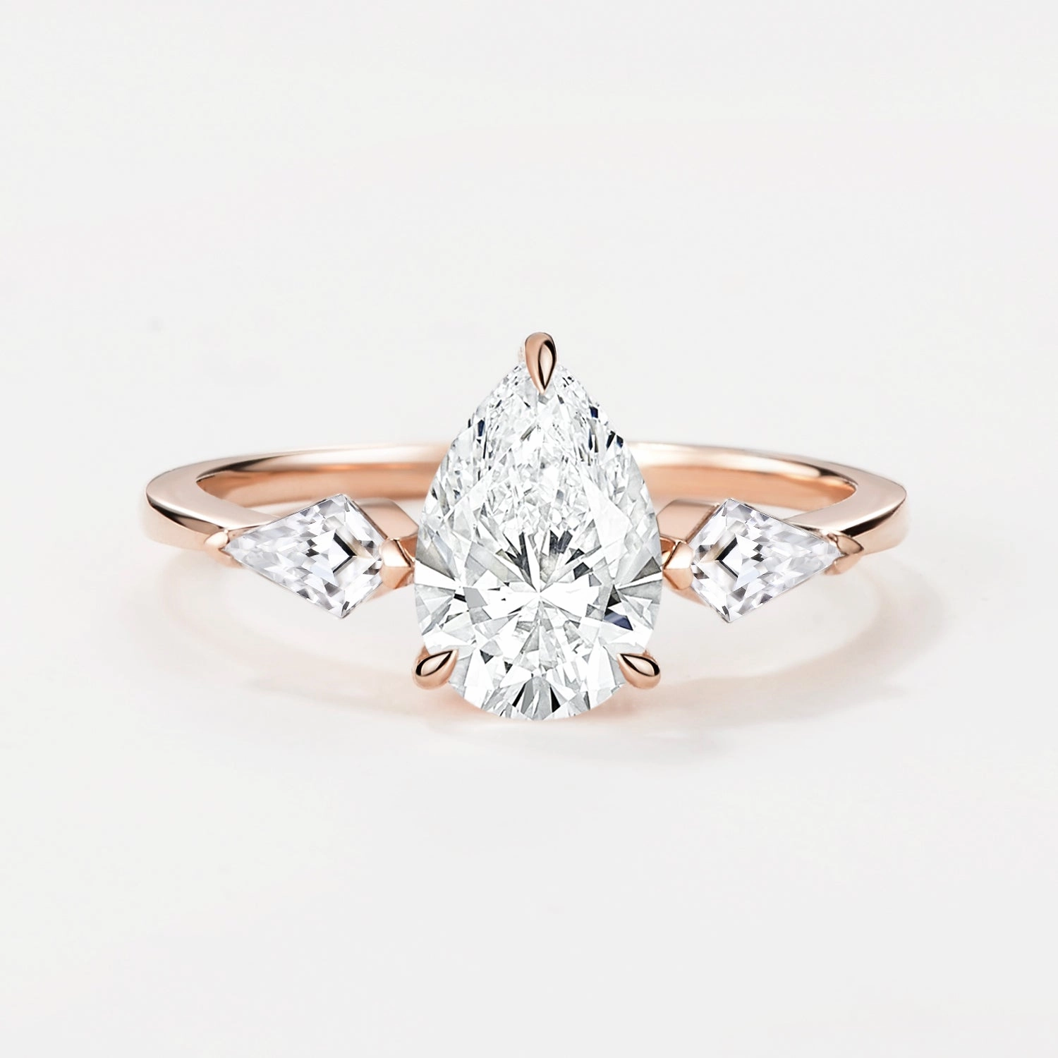 Camera Ready 1.0ct Pear Shaped Colorless Lab Grown Diamond Three Stone Gold Ring