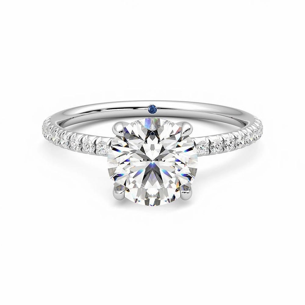 Four Prong Round Moissanite Engagement Ring with Hidden Anniversary Stone Accent Detail Pop