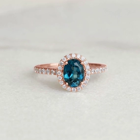 Oval London Blue Topaz Halo Ring Rose Gold - Suna Understated Mood